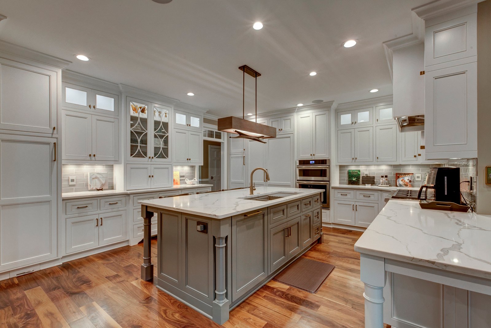 kitchen remodel with marble countertops and white cabinets